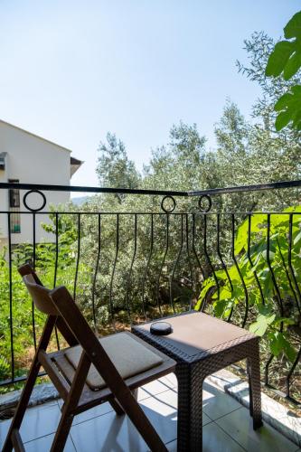 a patio with a table and a chair on a balcony at Güneş Boutique Hotel - Oludeniz in Oludeniz