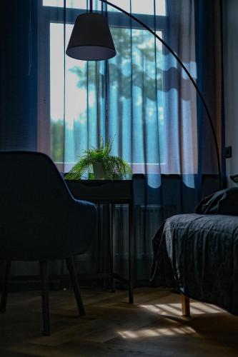 Ένα ή περισσότερα κρεβάτια σε δωμάτιο στο Pinska Business Apartment