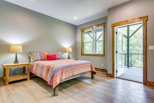 a bedroom with a bed and a window at 11 Mi to State Park Home with Dock in Mill Spring! in Mill Spring