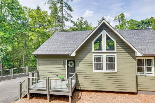 a home with a porch and a house at 11 Mi to State Park Home with Dock in Mill Spring! in Mill Spring