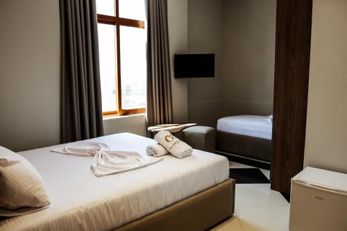 Postel nebo postele na pokoji v ubytování OLI Hotel