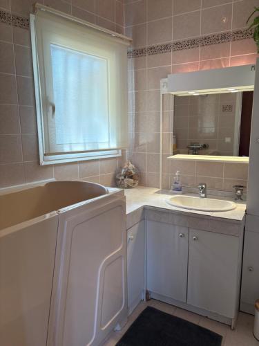 a bathroom with a sink and a mirror at Magnifique emplacement pour ce joli f3 in Cavalaire-sur-Mer