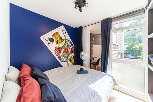 Ένα ή περισσότερα κρεβάτια σε δωμάτιο στο Superbe Loft 90m2 - Escape party et Jeux d'arcade