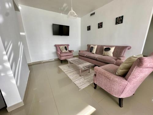 Μια τηλεόραση ή/και κέντρο ψυχαγωγίας στο Cómodo apartamento Familiar totalmente equipado con estratégica ubicación Isla de Margarita