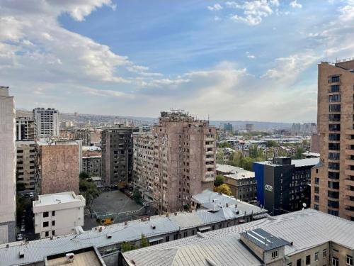 an aerial view of a city with tall buildings at Malibu park lux escape in Yerevan
