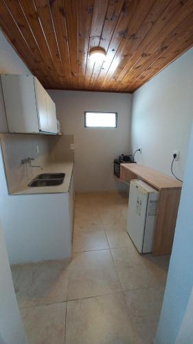 a kitchen with a sink and a counter top at Alojamientos Litoral - España 2 in Gualeguaychú