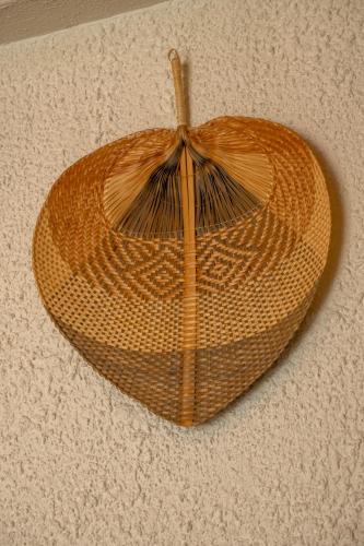 a large wicker basket on the floor at Güneş Boutique Hotel - Oludeniz in Oludeniz
