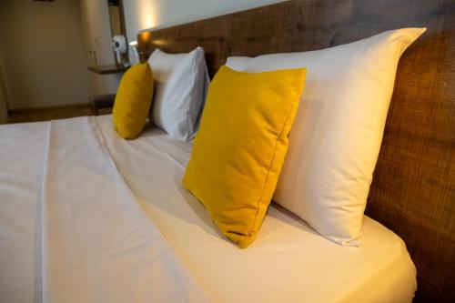 three pillows sitting on top of a bed at Güneş Boutique Hotel - Oludeniz in Oludeniz