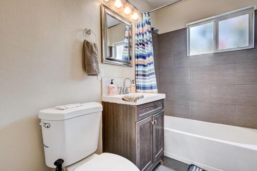 a bathroom with a toilet and a sink and a tub at 3 Bedrooms house in Marvelous Las Vegas in Las Vegas