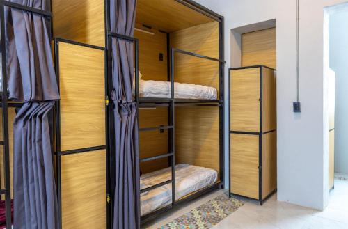 Ένα ή περισσότερα κρεβάτια σε δωμάτιο στο Hostal CASA MX bellas artes