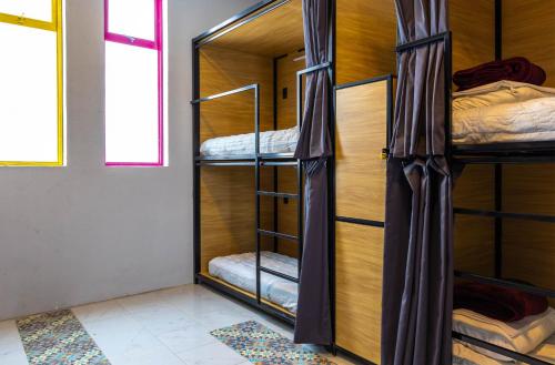 Ένα ή περισσότερα κρεβάτια σε δωμάτιο στο Hostal CASA MX bellas artes