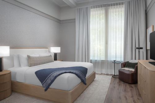 a bedroom with a large bed and a window at The Inn at Dayton in Dayton