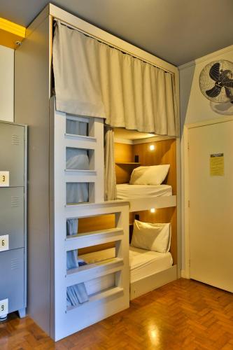 a largeerness room with bunk beds in it at Lamparina Hostel in Sao Paulo