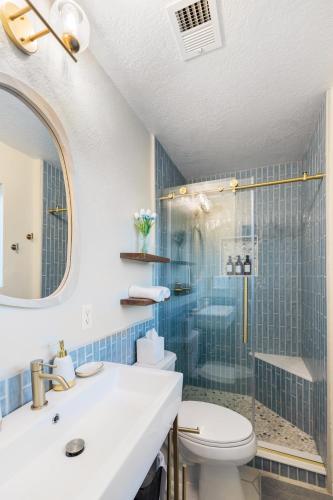 a bathroom with a shower and a toilet and a sink at Chic Scottsdale Escape with Pool in Scottsdale