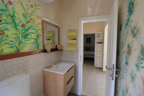 a bathroom with a sink and a mirror at Family friendly house with a swimming pool Rukavac, Vis - 24700 in Vis