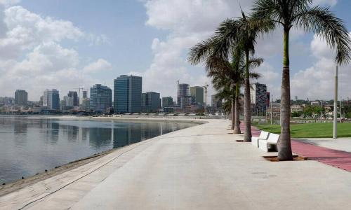 a sidewalk with palm trees next to a body of water at AM Apparts Suite Jacuzzi in Belas
