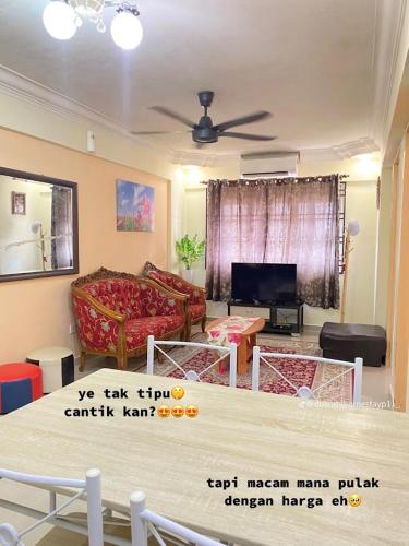 a living room with a couch and a table at HomestayP11 in Putrajaya