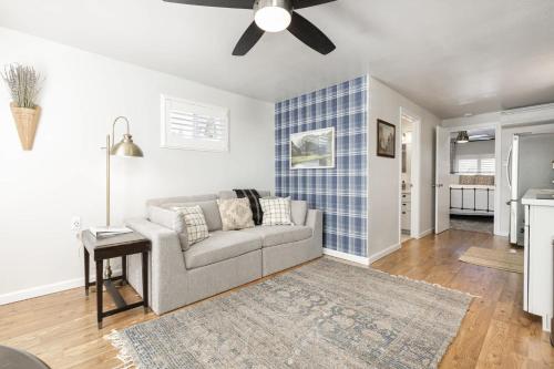 a living room with a couch and a ceiling fan at Mountain View Apartment in North Fork