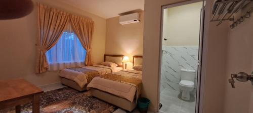 Postel nebo postele na pokoji v ubytování Tamar Merindu Home2Stay