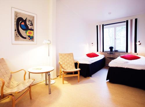 Postel nebo postele na pokoji v ubytování Ekebacken Hotell & Konferens