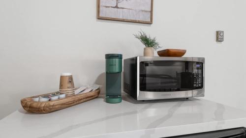 a microwave sitting on top of a kitchen counter at Camp Nelson Lodge Room 6 in Ponderosa