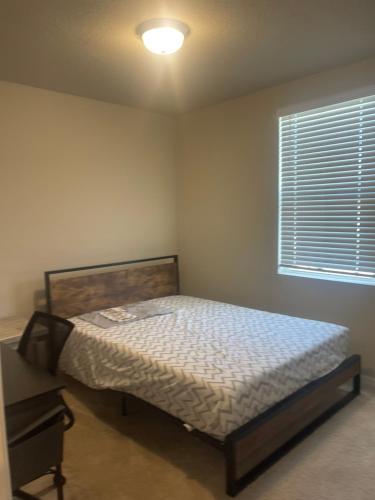 a small bedroom with a bed and a window at Parrish villa in Parrish