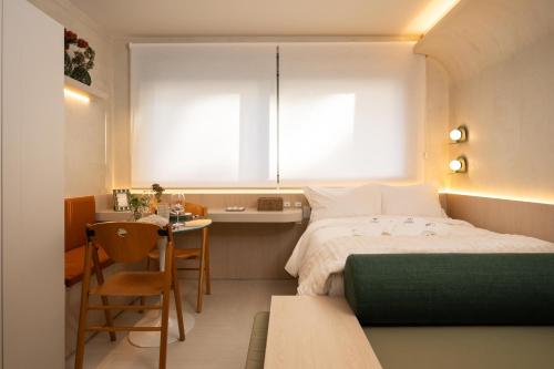 Katil atau katil-katil dalam bilik di Tempo The Arch - Bela Vista, Auxiliadora, Apartamentos em Porto Alegre
