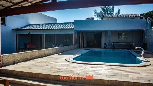 Πισίνα στο ή κοντά στο Casa em Araruama com piscina perto da Praia Abel