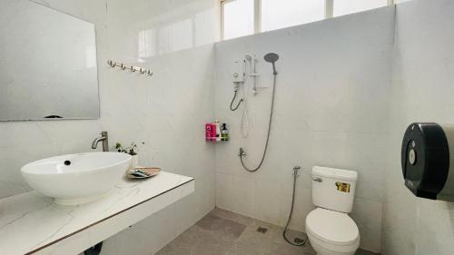 a bathroom with a sink and a toilet and a shower at TATEK Villa in Kampot