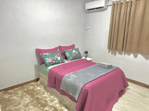 Ένα ή περισσότερα κρεβάτια σε δωμάτιο στο Hotel Residencial Manaus - Flores
