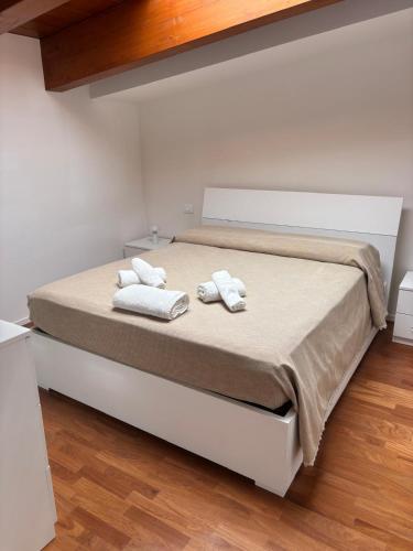 a bedroom with a bed with two towels on it at aMare27 in Citta' Sant'Angelo