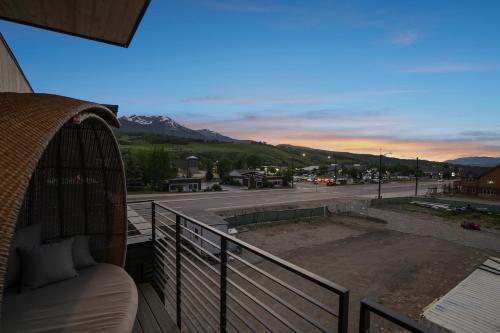 a balcony with a view of a parking lot at 4-Season Modern Mountain Penthouse with Private Hot Tub & Scenic Views in Silverthorne