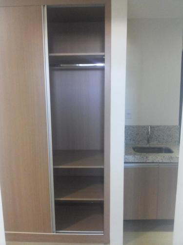 a refrigerator in a kitchen with its door open at Hotel Real in Montes Claros