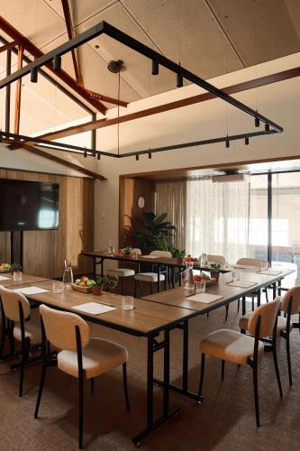 a large conference room with a large table and chairs at 1 Hotel Melbourne in Melbourne