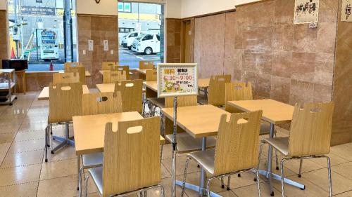 a classroom with desks and chairs and a chalkboard at Toyoko Inn Wako-shi Ekimae in Wako
