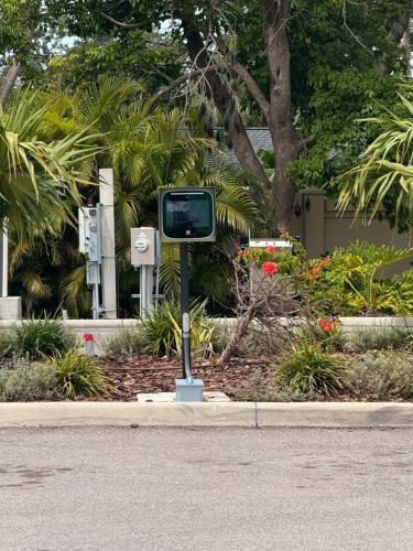 a street sign on the side of a road at Waterside Retreat: Modern 2BR, Mins to Beach & Apt in Sarasota