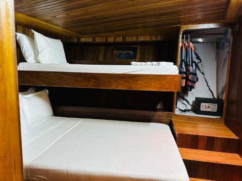 two bunk beds are in a room with at Flying Fish in Male City