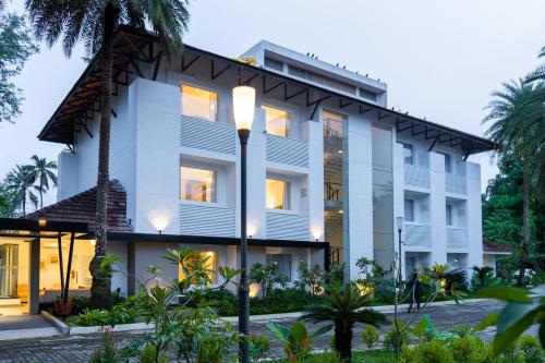 a rendering of the exterior of a building at Hotel Riviera Garden in Cochin