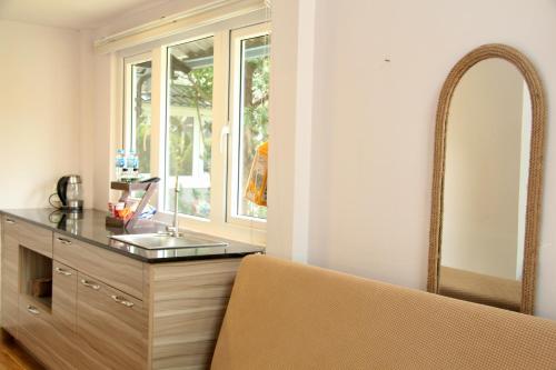 a bathroom with a sink and a mirror at Homestay Đà Lạt - The November Stay in Da Thanh