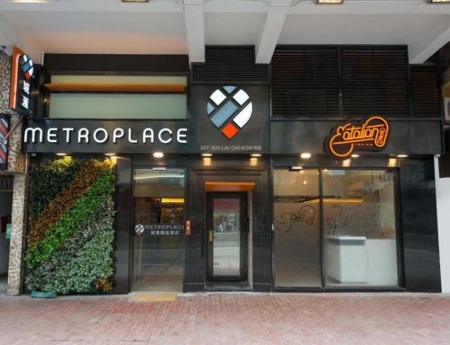 a store with a sign on the front of a building at Metroplace Boutique in Hong Kong