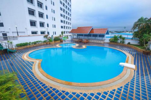an overhead view of a large swimming pool in a building at K.P. Grand Hotel Chanthaburi in Chanthaburi