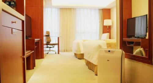 TV a/nebo společenská místnost v ubytování Xian Qujiang Yinzuo Hotel