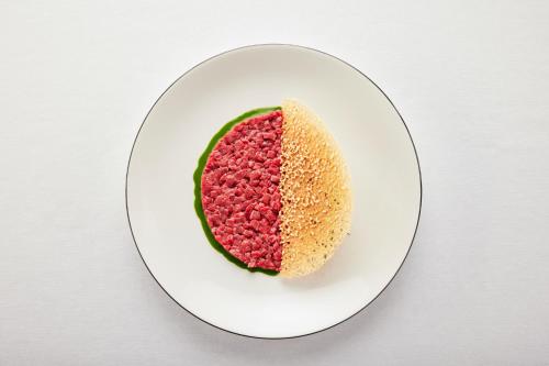 a piece of cake on a plate on a table at Palanga Life Balance SPA Hotel in Palanga