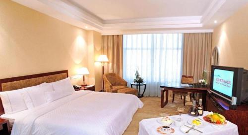 Letto o letti in una camera di Urumqi Tianyuan Hotel