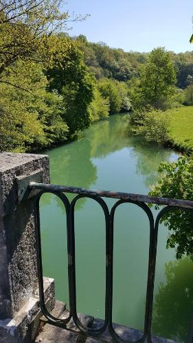 a view of a river from a balcony at Chambre D´hôtes Léonie & Restaurant in Druillat