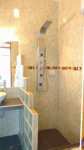 a bathroom with a shower and a sink at Bella Vista condominio in Canoas de Punta Sal
