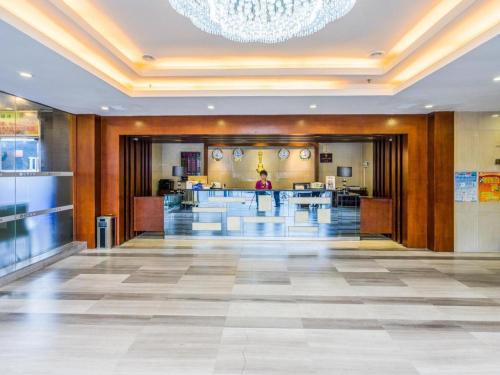 a lobby of a building with a chandelier at Movie Star Hotel in Guangzhou