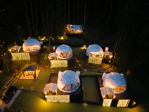 an overhead view of a group of domes at night at TOCORO. Mt.Fuji CAMP&GLAMPING in Fujikawaguchiko