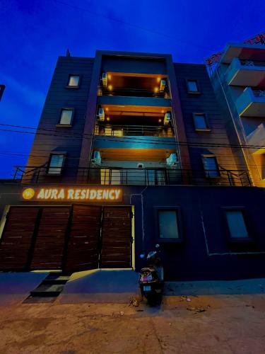 a building with an alpha residency sign on the side of it at Hotel Aura Residency , Haridwar in Haridwār