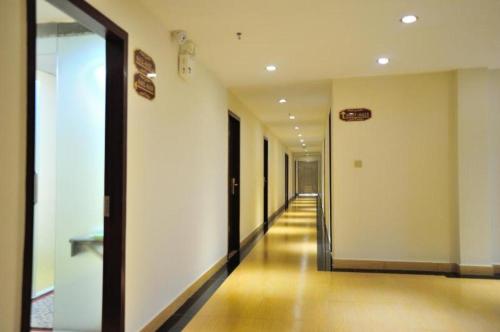 a hallway of a building with a long corridor at Jian Guo Grand Hotel in Vientiane
